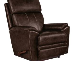 PRESALE - $450 EACH.....NEW $2,000 EACH, CURRENT NEW SALE PRICE $750 La-Z-Boy® Talladega Chestnut Leather Manual Rocking Recliner La-Z-Boy Model #:  010754 LB159079 leather- Simply use the convenient handle on the outside arm to raise the leg rest for reading, relaxing or watching TV. When you’re not reclining, it’s a relaxing rocker with a smooth, graceful motion.  Sleek, streamlined style with racing stripe detail  Handsome top-stitching  Chaise seat and leg rest create a continuous zone of comfort  Supportive tall foam back  Rocks and reclines for total comfort  Chair back can recline independently, without activating the leg rest  Adjust the leg rest with the convenient side-mounted handle  3-position locking leg rest for added safety and support  Double-picked blown fiber fill for improved cushion loft and shape retention  High grade foam seat cushions that maintain their comfort and appearance  Premium grade leather tested to resist wear and fading  Handcrafted in North America 