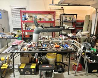 Mechanical and fitness assets, headlined by a commercial-grade Life Fitness treadmill and a large Atlas Safe Room steel vault. The workspace is anchored by a DeWalt compound miter saw and a comprehensive collection of hand tools, including various pipe wrenches, hammers, and carpentry squares. Storage solutions include a heavy-duty Stanley FatMax rolling project center and a red industrial-grade bulk racking unit, making this a prime selection for contractors or home workshop enthusiasts.