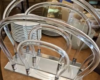 Mid-century modern Lucite magazine holder.