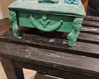 Metal footed box with lid.