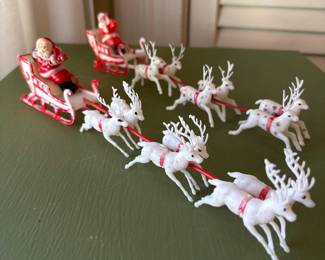 042 pairofvintageplasticsantasleighswi