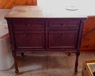 Older Victrola with lots of records.