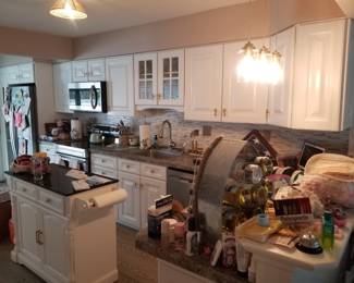 Kitchen includes all upper & base cabinets, counters, sink, faucet & disposal