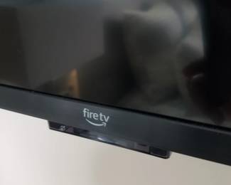 Flat screen smart TV with wall bracket