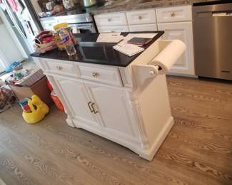 Two-drawer cupboard servs as a kitchen island