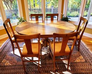 A warm and inviting mid-century inspired dining set that blends clean lines with everyday functionality.