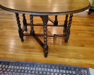 Gateleg drop-leaf design for flexible use Barley twist legs with stretchers for stability Rich wood tone with classic, timeless appeal Ideal as a dining table, entry piece, or accent table