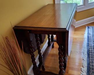 Gateleg drop-leaf design for flexible use Barley twist legs with stretchers for stability Rich wood tone with classic, timeless appeal Ideal as a dining table, entry piece, or accent table