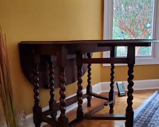 Gateleg drop-leaf design for flexible use Barley twist legs with stretchers for stability Rich wood tone with classic, timeless appeal Ideal as a dining table, entry piece, or accent table