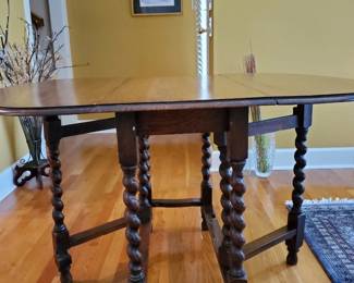 Gateleg drop-leaf design for flexible use Barley twist legs with stretchers for stability Rich wood tone with classic, timeless appeal Ideal as a dining table, entry piece, or accent table