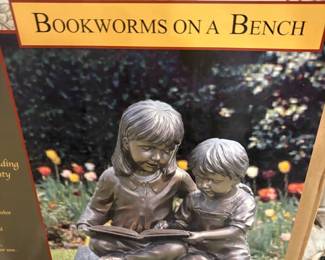 Stone Bookworms on a Bench Statue