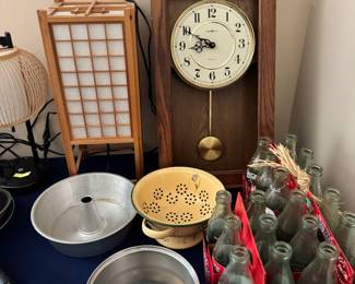 lamps, clock, pans, empty Coke bottles