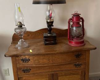 small antique wooden cabinet, lantern, oil lamp, bicentennial lamp