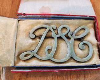 This is a carved Jade Pin.