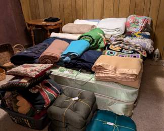 Assorted blankets, throw pillows and cushions 