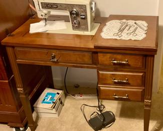 Sewing machine in cabinet, sews well
