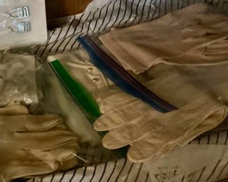 Lots of  leather and cotton gloves 