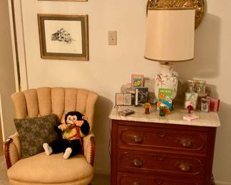 Upholstered yellow chair,  monkey with banana, playing cards, bridge sheets