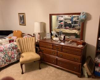 Vintage dresser with mirror, upholstered arm chair, full bed