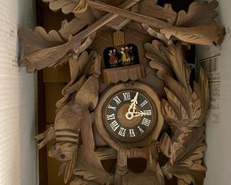 This cuckoo clock is still in the box, which explains why the deer's head is turned sideways.