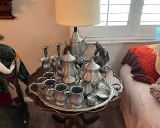 The drinking cups, small bowls, and serving set appears to be pewter (please correct me if I'm wrong) and pairs nicely with the table/lamp.  Don't miss the candlestick holders (in case you're planning a live-action game of Clue).  And the statuette looks rather pensive.