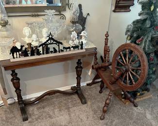 This sale has an eclectic collection, for sure.  See the spinning wheel?  That is one of those really useful hobbies to start (as long as you're not Sleeping Beauty).  There is also a nativity scene and a few small bust statues.