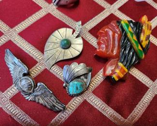 Far Top Right - Vintage Bakelite Native American Chief Brooch. Others are Turquoise with Silver. Bottom Left...Vintage Style Sterling Silver Angel Wings Brooch.