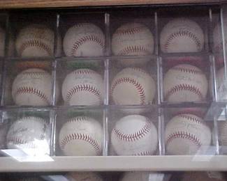Lots of signed baseballs.