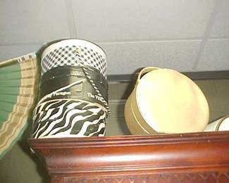 Hatboxes, some with hats.