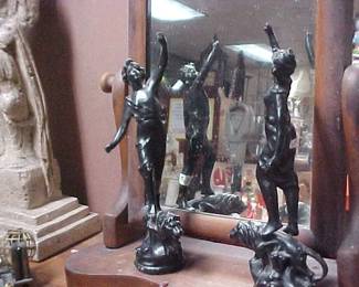 Statues.  Shaving mirror and stand.