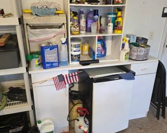 Small refrigerator and cleaning supplies