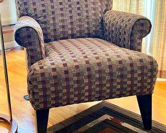 TASTEFULLY UPHOLSTERED ARM CHAIR