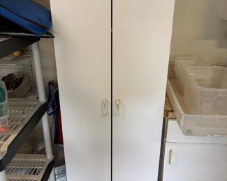 White 2 door storage cabinet $125.00.  24”w 25”d 70”t one shelf