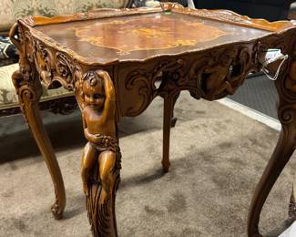 Figure carved table