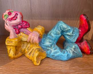 Colorful reclining clown ceramic figurine