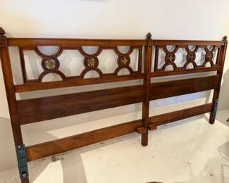 Ornate wooden headboard with carved detail