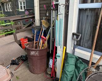Assorted Garden Tools and Wind Chimes