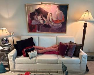 Figurative Oil Painting and Cream Colored Sofa