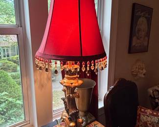 Ornate Gilt Figural Table Lamp with Red Bell Shade