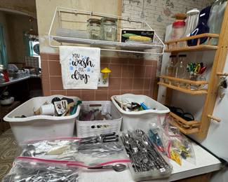Lots of kitchen tools, silverware sets