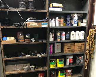 Shelves of lots of items in shop.  Oil, filters etc