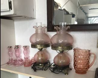 Pink lamps, candlesticks, pitcher