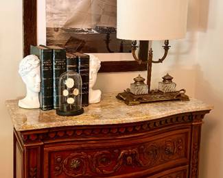 Theodore Alexander chest w/marble top, French inkwell lamp w/new linen shade, antique books, modern Anthropologie bookends, grand tour intaglios