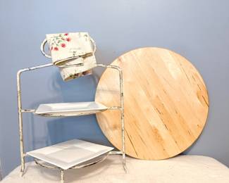 Rustic white metal two-tiered serving stand and light wood circular board