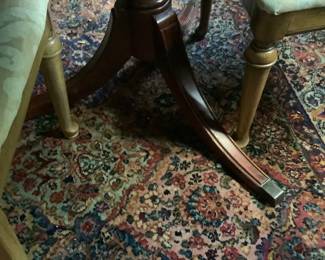 The legs on the table.  This table has a center leaf and pad to put on table.