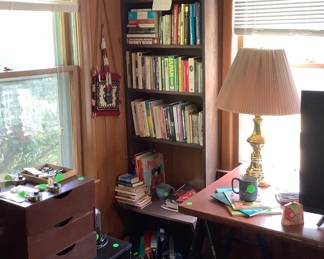 A lot of bookcases, cabinets, cabinets with rollers.