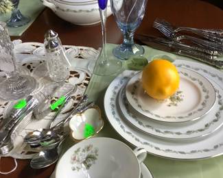 Sitting at the end of the plates are cobalt blue wine/champagne glasses and light blue Fostoria glasses. 