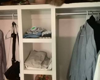 More clothes, and hats, fur pieces in master bedroom.