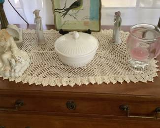 Sitting on top of an antique 4 drawer chest in walnut are two gorgeous blue crystal, marble at bottom.  Also a hand crotchet doily.