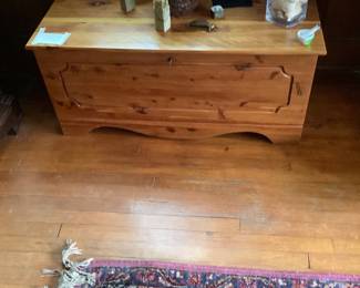 Oak cedar chest by fireplace.  Excellent condition.